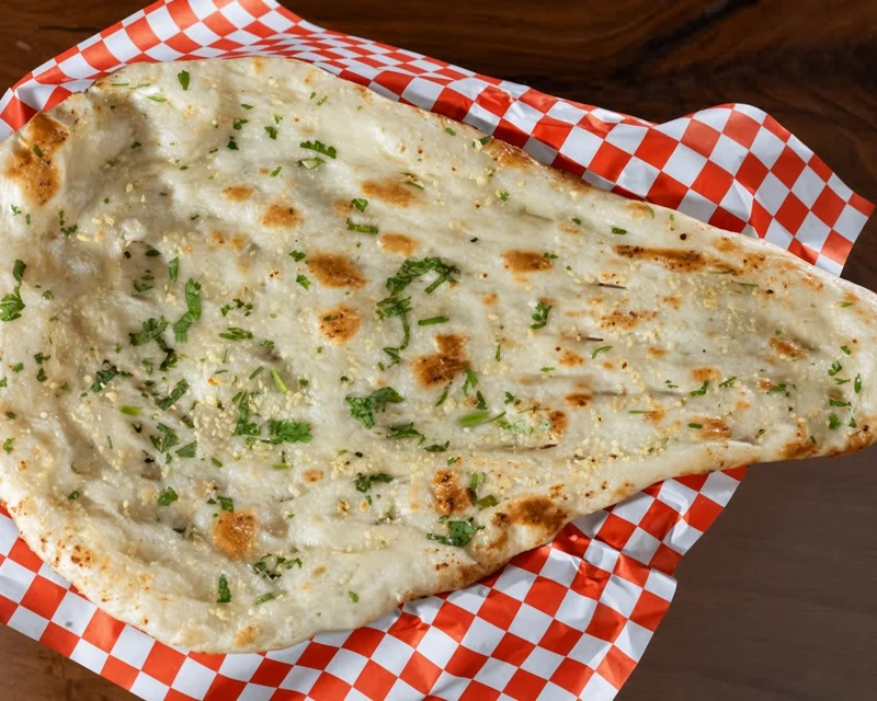Garlic Naan, Indian bread at de Delhi Indian & Hakka Kitchen in Mississauga